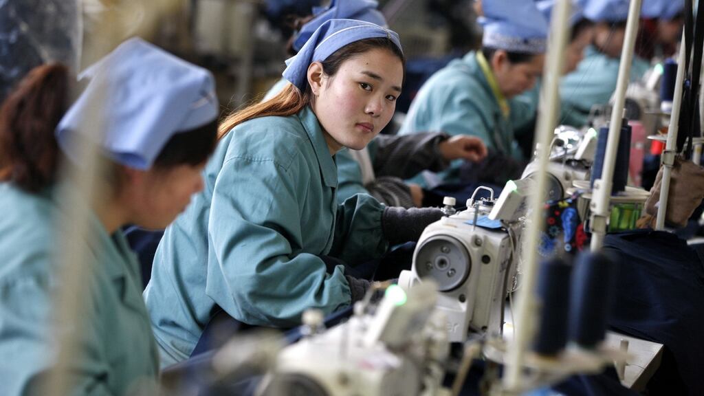 Women work in a clothes factory in Huaibei, Anhui province, China. China said its GDP expanded by 6.9 per cent in 2015, the slowest growth in 25 years. Photograph: EPA