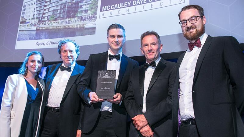 Derry Kearney, Awards Judge presents the Housing Project of the Year award to the McCauley Daye O’Connell Architects team.