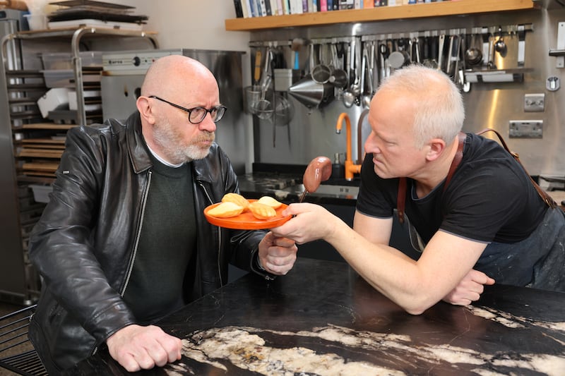 Irish Times film correspondent Donald Clarke and arts promoter turned baker Gerry Godley in Gerry's kitchen in Dublin, with Madeleines and kidney. Photograph: Dara Mac Dónaill
