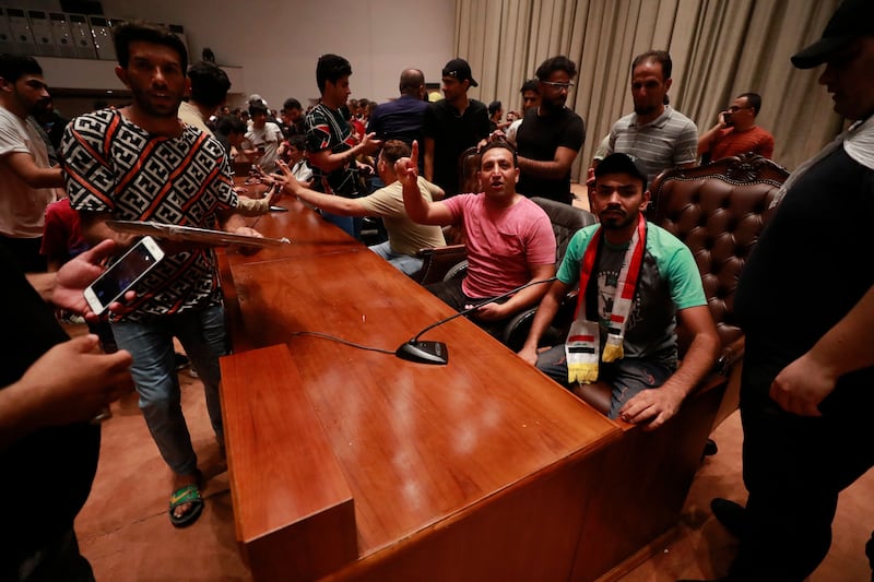 Supporters of the Iraqi cleric Moqtada Sadr inside the Iraqi parliament in Baghdad. Photograph: Ahmad al-Rubaye/AFP via Getty Images
