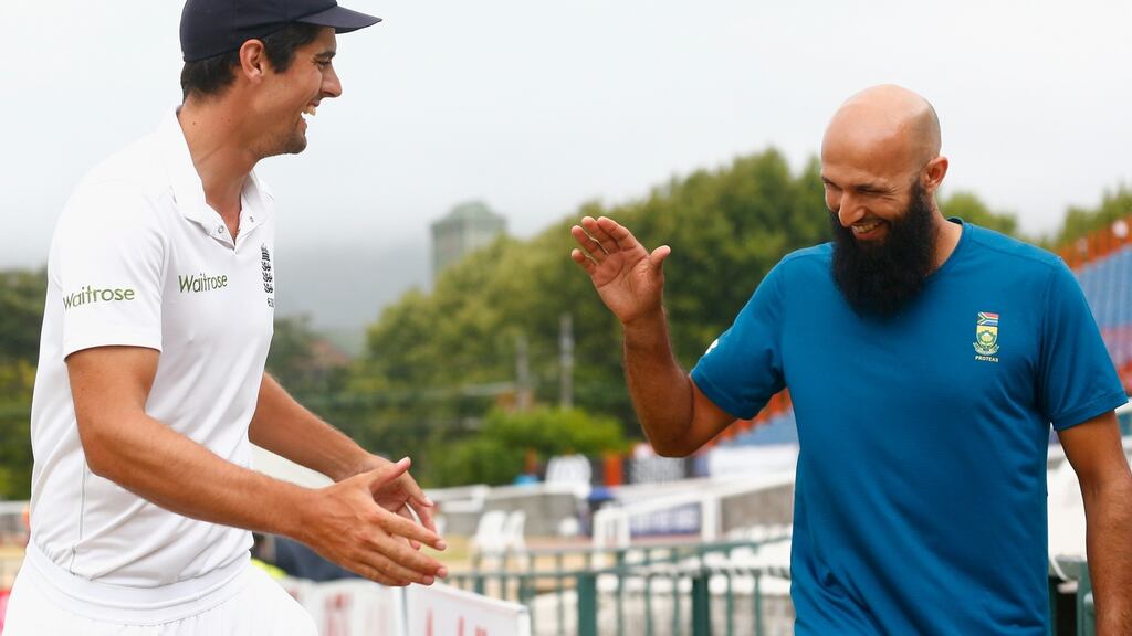 England’s Alastair Cook shakes hands with Hashim Amla after the second Test ended in a draw at Newlands Stadium. Photograph: Julian Finney/Getty Images