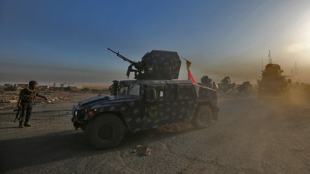 Iraqi forces hold positions about 45km south of Mosul on October 17th. Some 30,000 federal troops are leading the offensive against Islamic State, backed by air and ground support from a US-led coalition. Photograph: Ahmad al-Rubaye/AFP/Getty Images