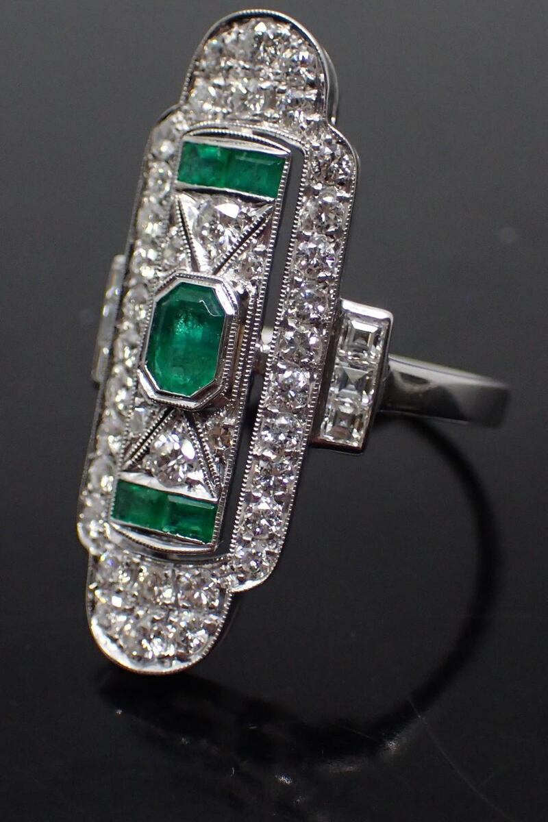 An 18ct gold diamond and emerald ring, €1,700-€2,200, John Weldon