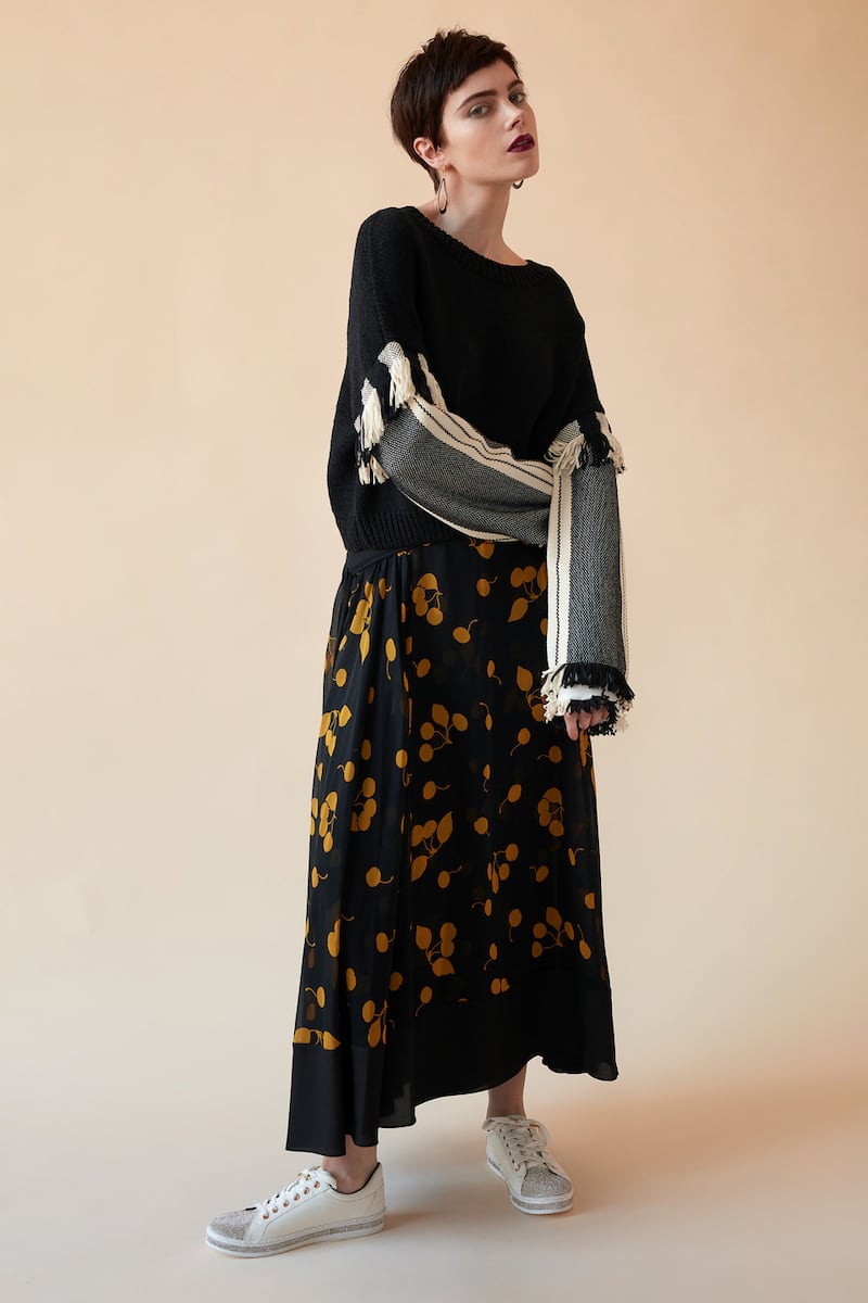 Jumper €500, skirt €705 Philip Lim Brown Thomas. Trainers €50 River Island.