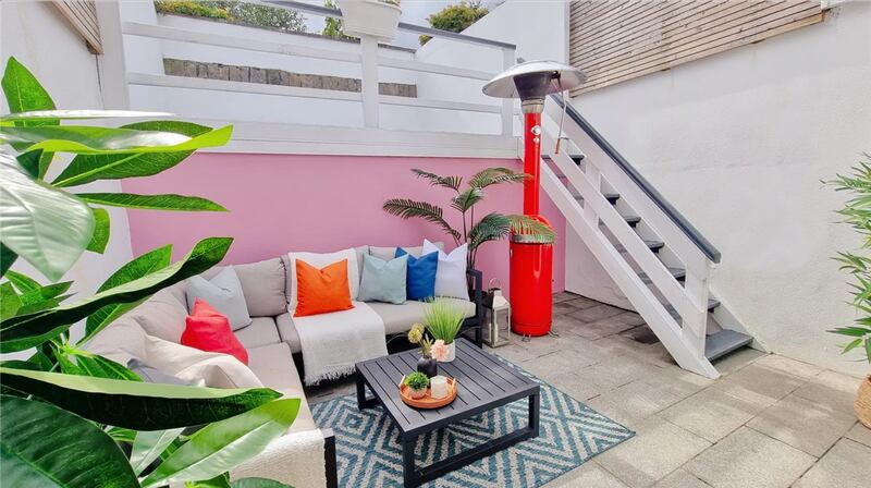 The attractive split-level terrace in the back garden provides a great space for entertaining or relaxing.