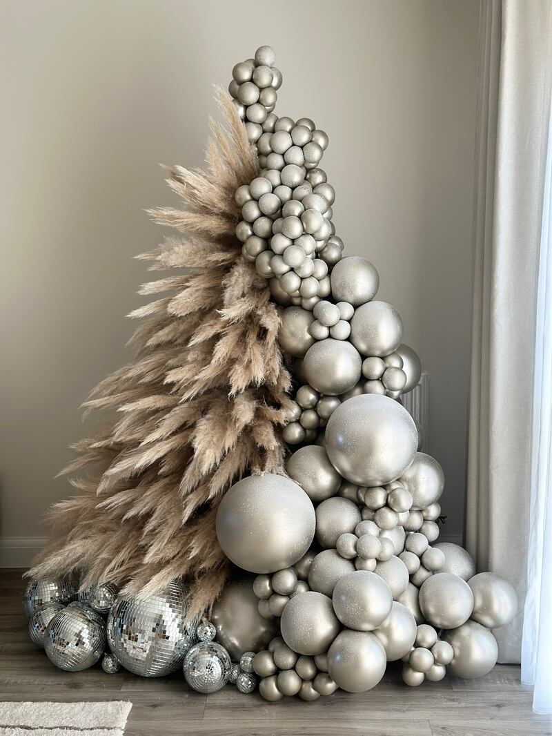 Event stylist Ros March of Fig and Form created a stunning alternative Christmas tree from balloons, disco balls and pampas grass