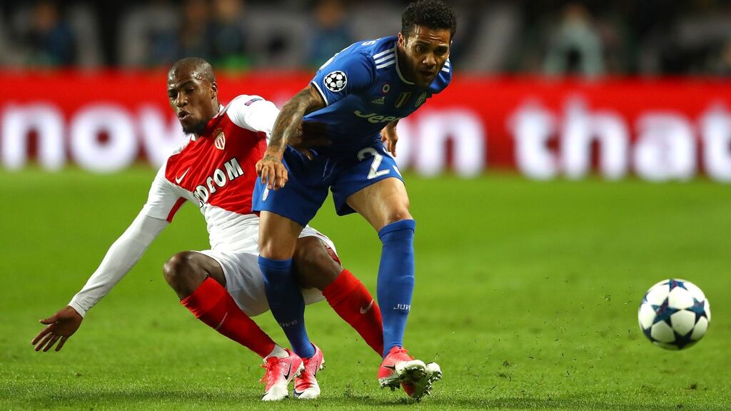 Fabinho of AS Monaco tackles Dani Alves of Juventus at Stade Louis II on Wednesday night. Photograph: Michael Steele/Getty Images