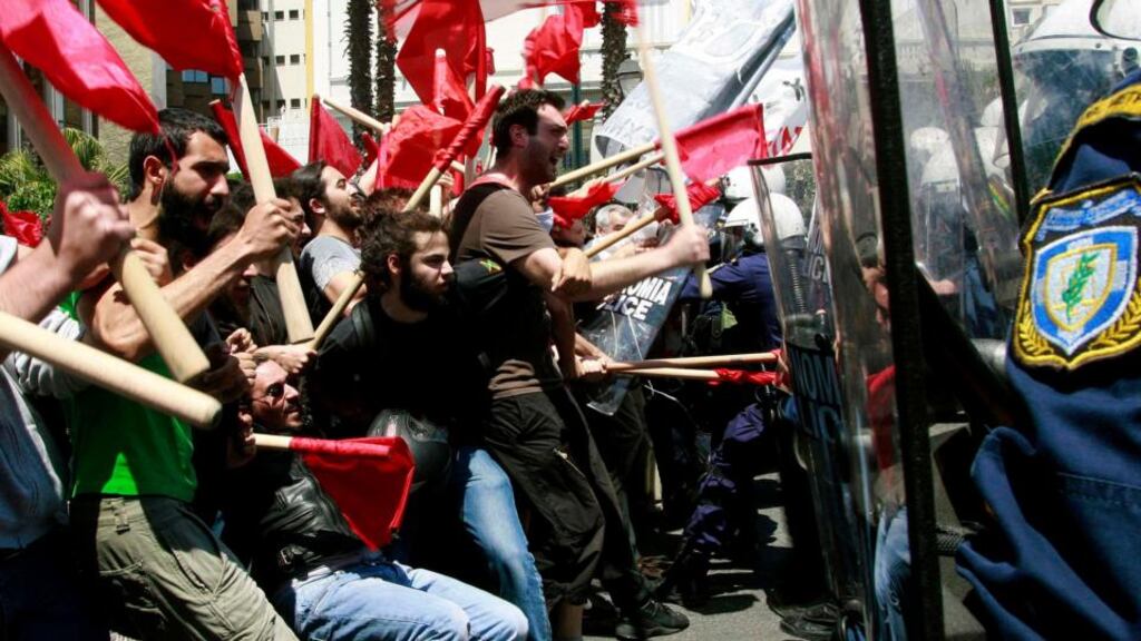 Protesters clash with policemen during riots at a May Day rally in Athens in 2010.