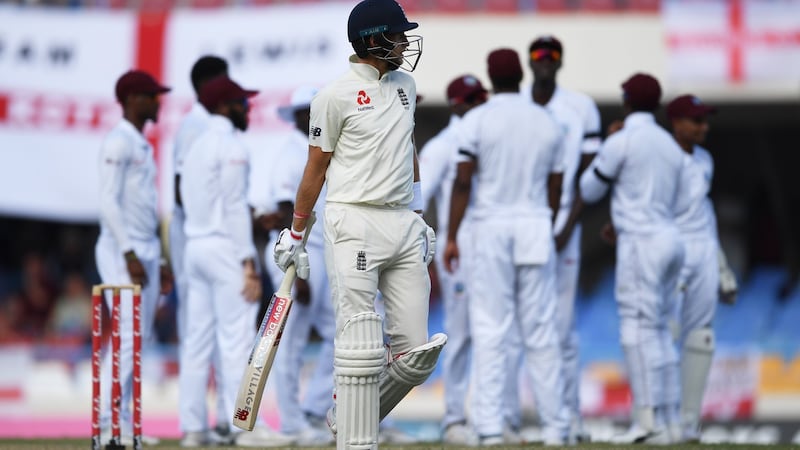 Joe Root trudges off after his dismissal in Antigua. Photograph: Shaun Botterill/Getty