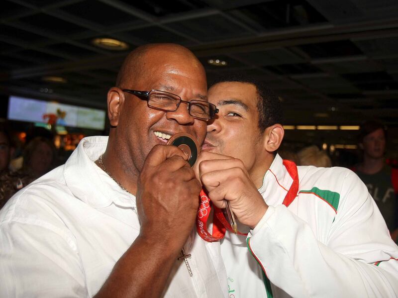 Olympic bronze medal winner Darren Sutherland is greeted by his father Tony in August 2008. Photograph: James Crombie/Inpho