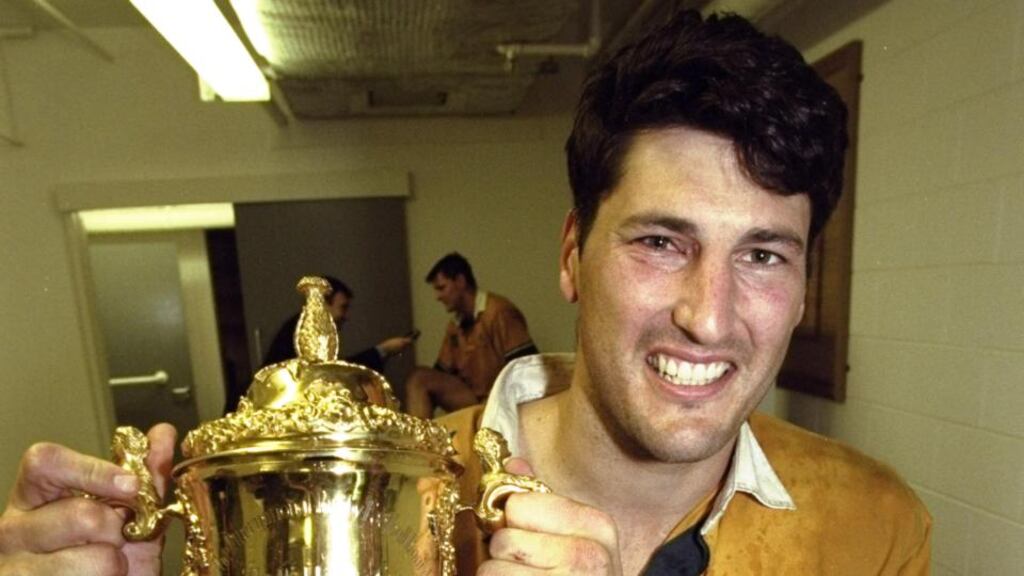 Australia captain John Eales holds the Webb Ellis trophy after winning the final of the 1999 Rugby World Cup against France at the Millennium Stadium in Cardiff. A number of Australian media companies will not send journalists and photographers to this year’s event because of what they say are unreasonable restrictions on covering the event. Photo: Dave Rogers /Allsport
