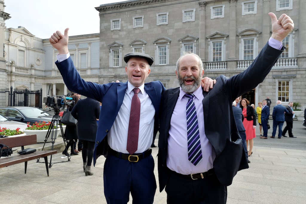 Michael and Danny Healy Rae on the plinth outside Leinster House. Both are millionaires who have business dealings with the State. Photograph: Alan Betson