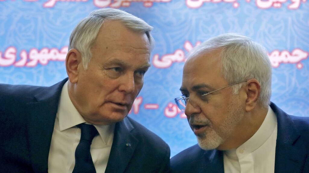 French foreign minister Jean-Marc Ayrault and Iranian foreign minister Mohammad Javad Zarif in Tehran on Tuesday. Photograph: Atta Kenare/AFP/Getty Images