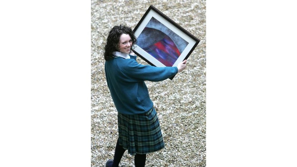 Jenny Ring from St Paul's Secondary School, Greenhills, Dublin,
with her painting, Written in My Dreams, which represents Ireland
at an exhibition at the Tate Modern.