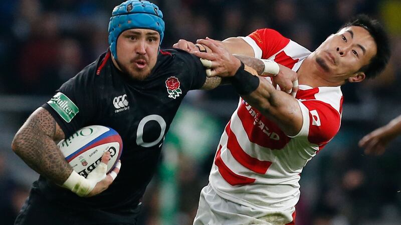 England centre Jack Nowell hands off Japan’s wing Kenki Fukuoka during the autumn international at Twickenham. Photograph: Ian Kington/AFP/Getty Images
