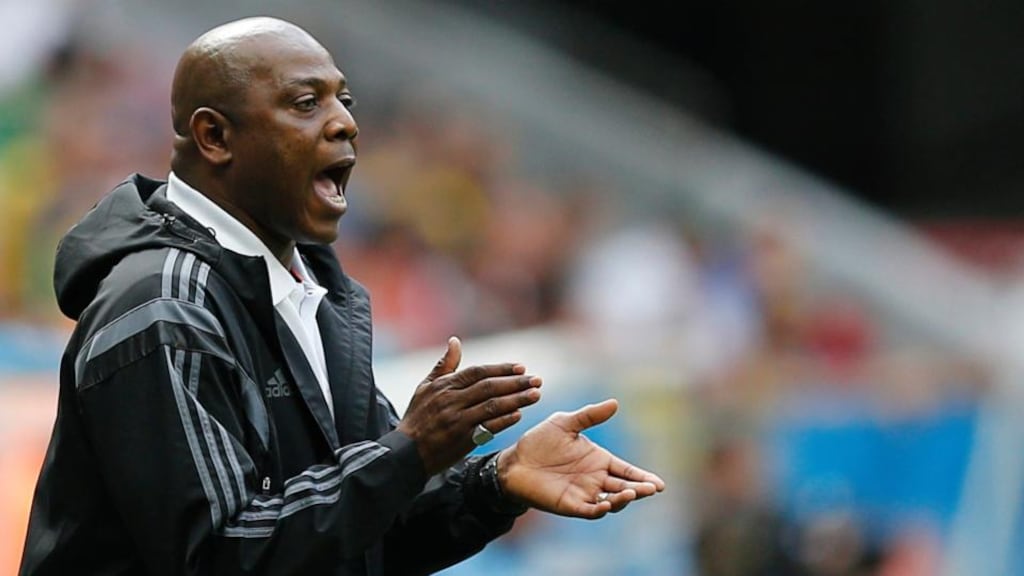 Nigeria's coach Stephen Keshi cheers on his team during their 2014 World Cup round of 16 game against France at the Brasilia national stadium in Brasilia June 30, 2014. REUTERS/Ueslei Marcelino (BRAZIL  - Tags: SOCCER SPORT WORLD CUP)