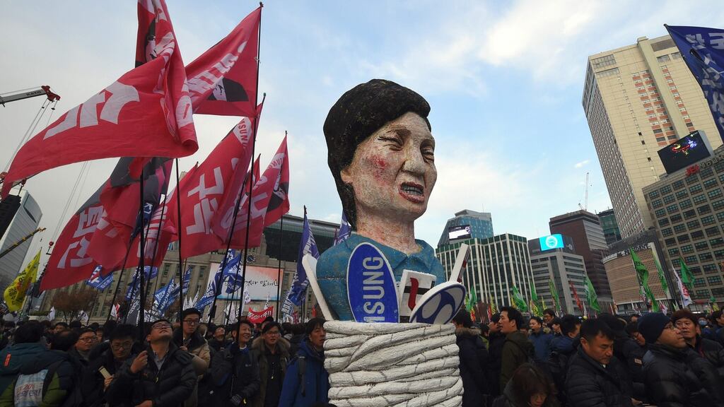 Protesters in Seoul carry an effigy of Park Geun-Hye during a rally demanding the resignation of the president. Photograph: Jung Yeon-Je/AFP/Getty Images