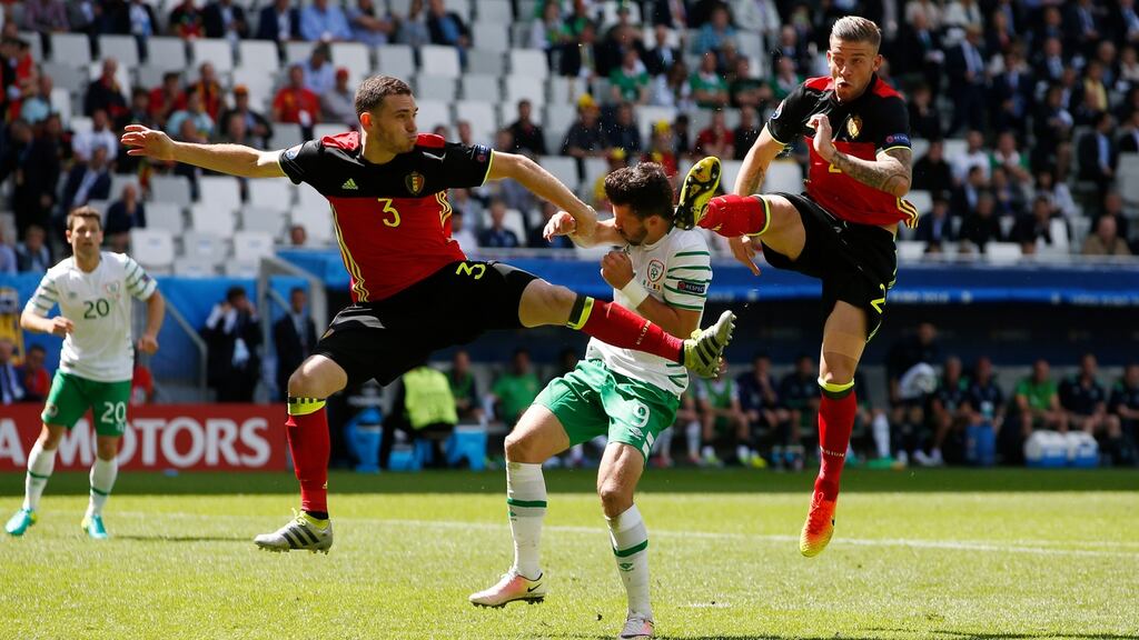 Shane Long had a tough afternoon against Belgium’s Thomas Vermaelen and Toby Alderweireld. Photograph: Reuters