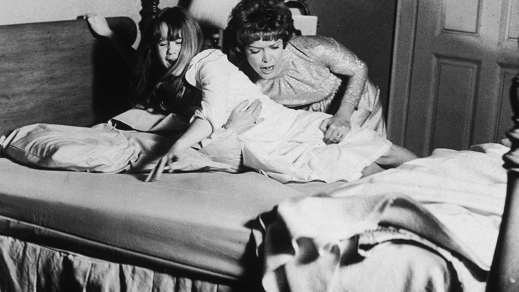 Ellen Burstyn restrains Linda Blair in a still from the film The Exorcist, directed by William Friedkin. Photograph: Warner Bros/Getty Images