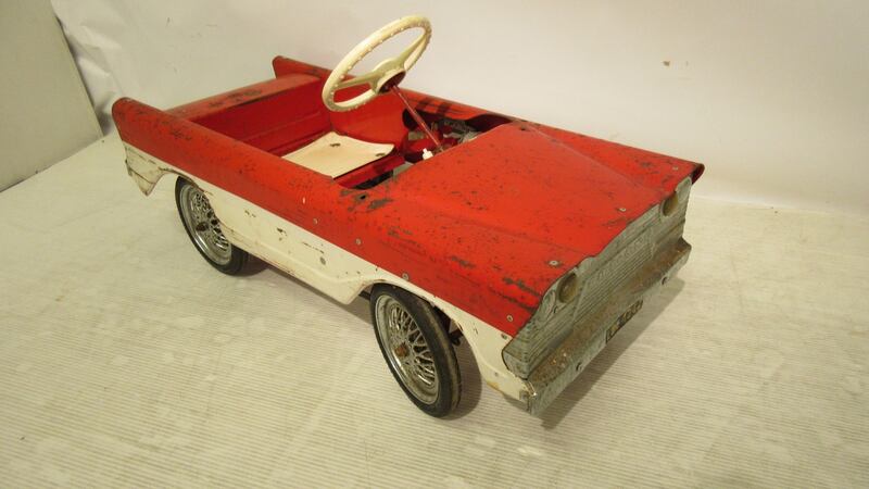 A Tri-ang metal pedal car (€150-€250)
