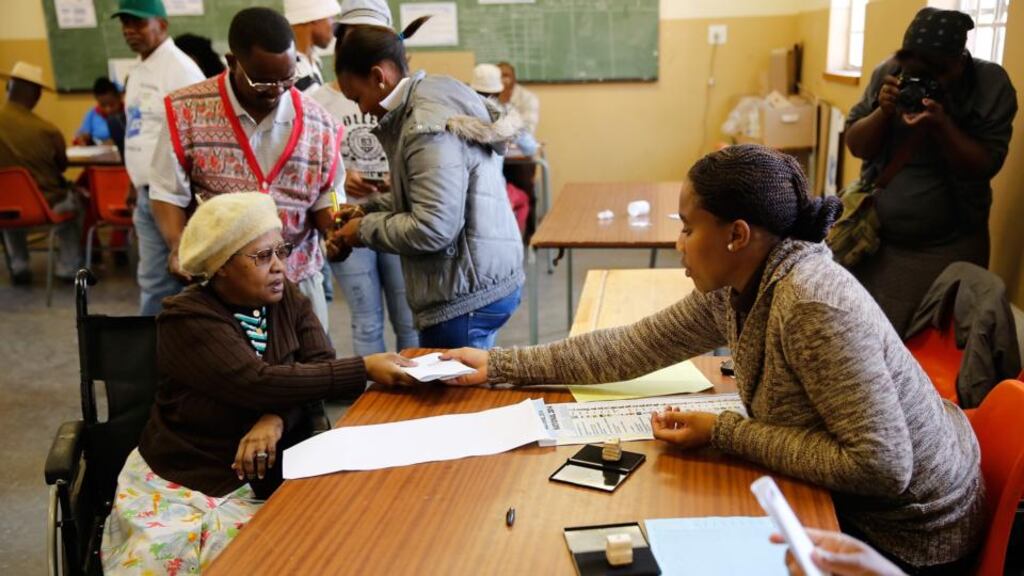 Fibongeni Ellen Ndalovevu has her identification checked before voting at the Orlando West Voting Station in the Soweto Township in Johannesburg on Wednesday. Photograph: Jemal Countess/Getty Images