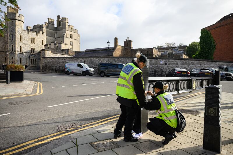 WINDSOR, ENGLAND - SEPTEMBER 15: Police search teams secure drains and gateways in Windsor ahead of Trump's visit. Photograph: Leon Neal/Getty