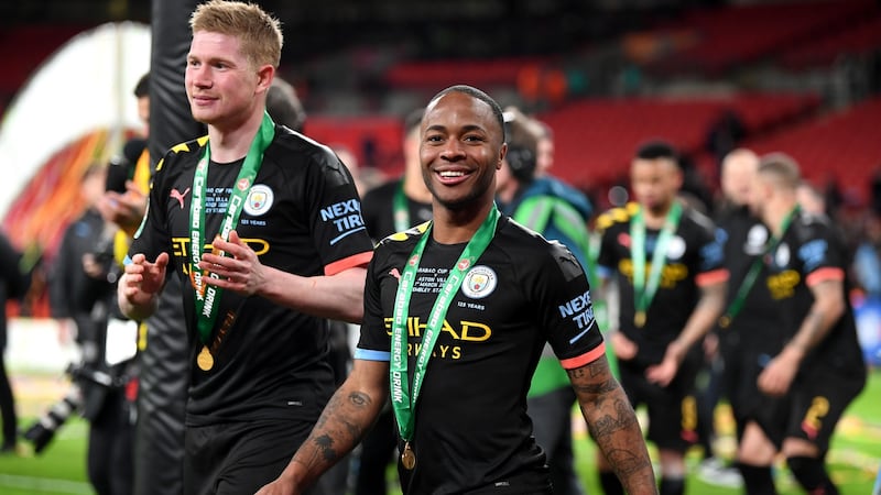 Raheem Sterling celebrates Man City’s League Cup win. Photograph: Getty