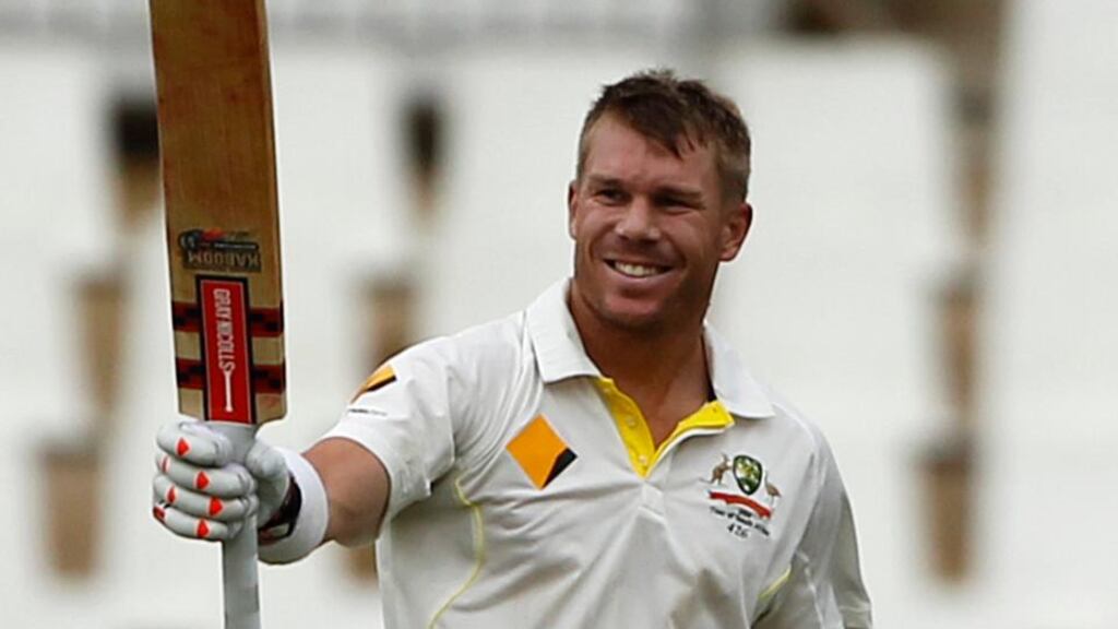 Australia’s David Warner celebrates his century during the third day of the first Test against South Africa in Centurion Park. Photo: Siphiwe Sibeko/Reuters