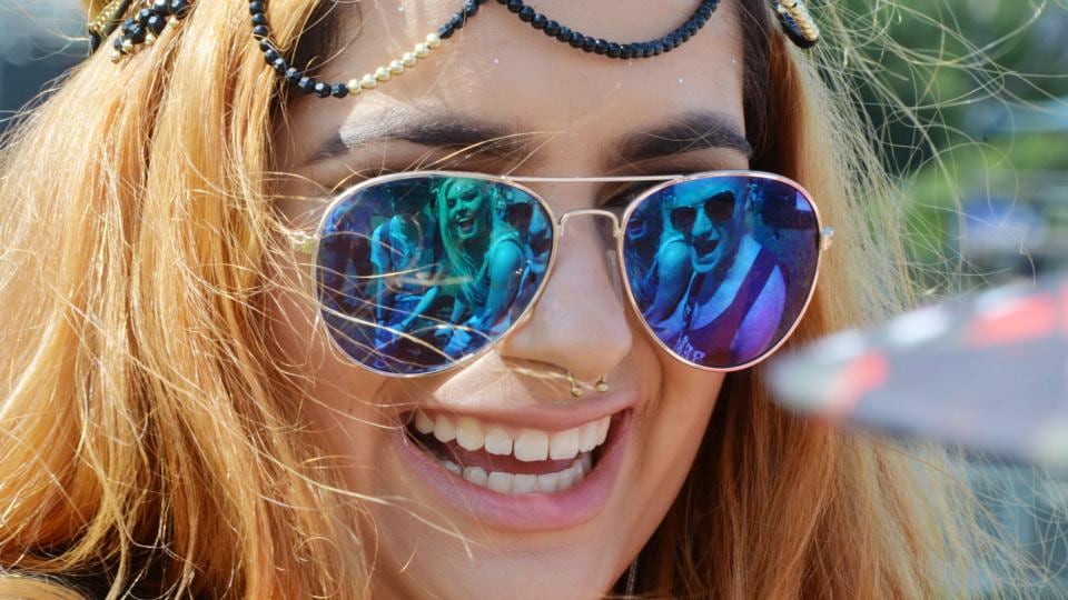 Alex Wojcik, with friends Josh Clinton, Niamh O’Donnell and David Styrogen (reflected in glasses) enjoying themselves at Longitude at Marlay Park. Photograph: Alan Betson/The Irish Times