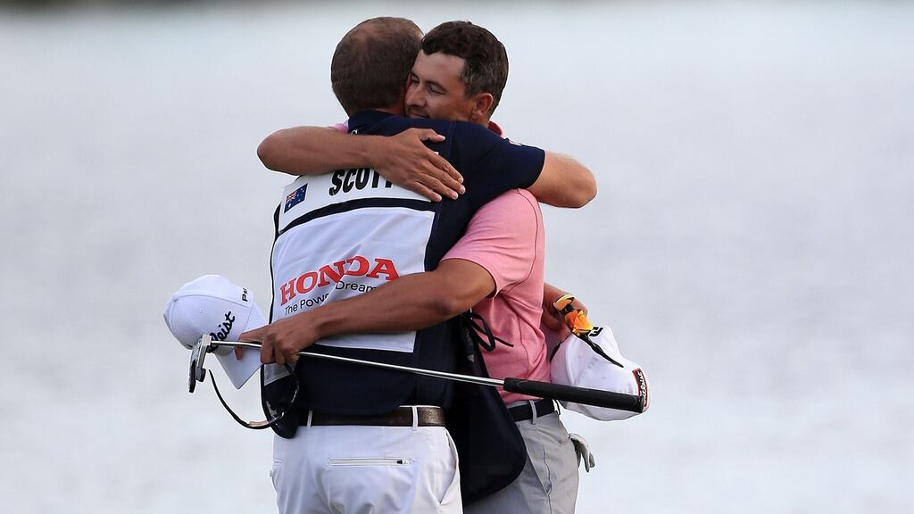 Adam Scott hugs his caddie David Clark following his victory at  the Honda Classic  in Palm Beach Gardens, Florida. Photograph: Sam Greenwood/Getty Images