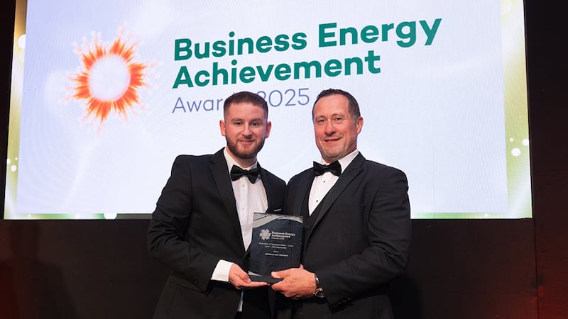 Adam Kane, community lead at BusinessRiver, presents the innovation in decarbonisation - large (over 1,000 employees) to Vincent Hudner, Johnson & Johnson