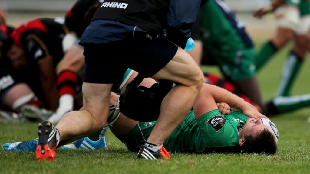 Connacht’s Jake Heenan clutches his shoulder in the Dragons match. Photograph: James Crombie/Inpho