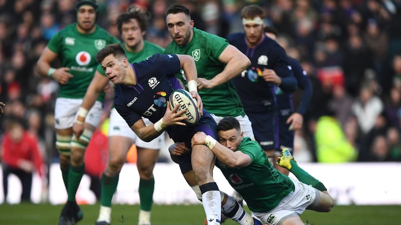 Scotland’s Huw Jones is tackled by John Cooney of Ireland. Photograph: Stu Forster/Getty Images