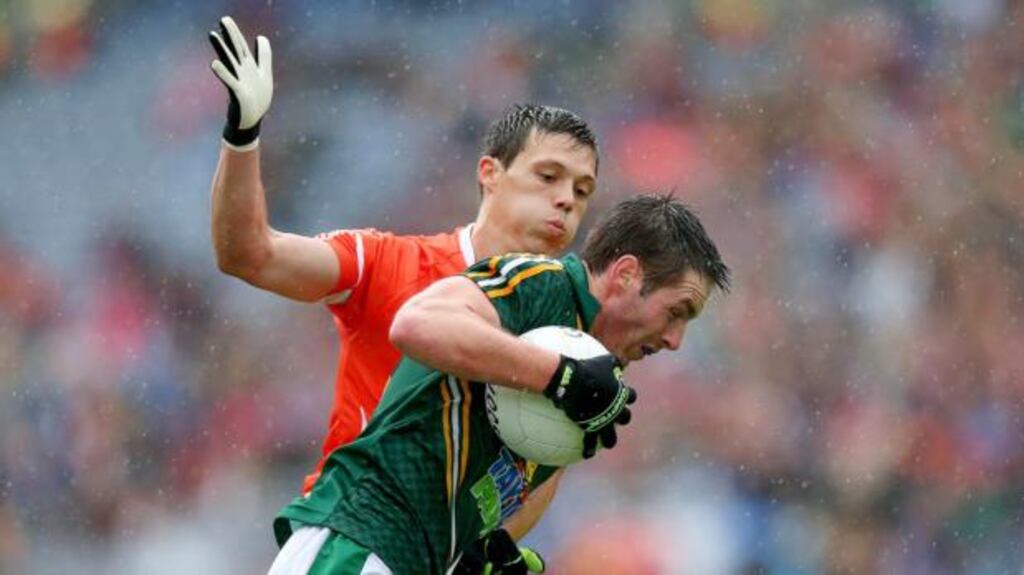 David Bray of Meath with struggles to find a way past James Morgan of Armagh at Croke Park. Photograph: Donall Farmer/Inpho