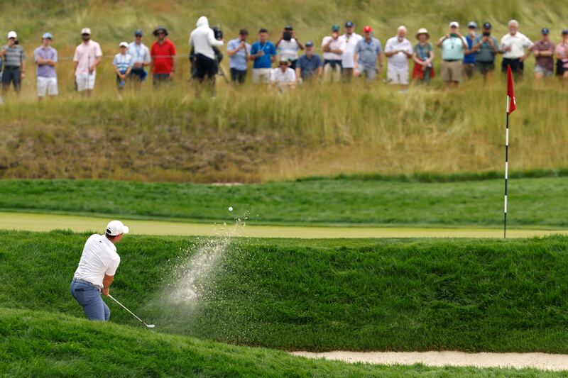 Rory McIlroy of Northern Ireland plays a shot from a bunker on the sixth hole at Oakmont. Photograph: Cliff Hawkins/Getty