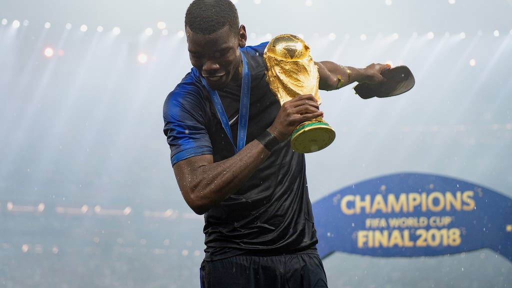 Paul Pogba of France celebrates with the World Cup trophy. Photograph: Matthias Hangst/Getty Images