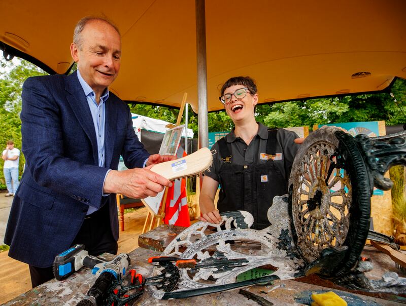 Taoiseach Micheal Martin and Nessa Doran O'Reilly, the furniture programme manager at the Rediscovery Centre in Ballymun, at Bloom festival in May. Photograph: Liam McBurney/PA Wire