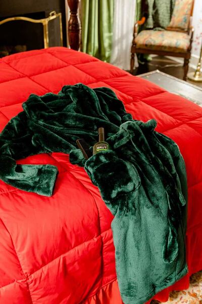 Home Alone: the green velvet robe – complete with aftershave – that Kevin McCallister wears in the movie. Photograph: Airbnb