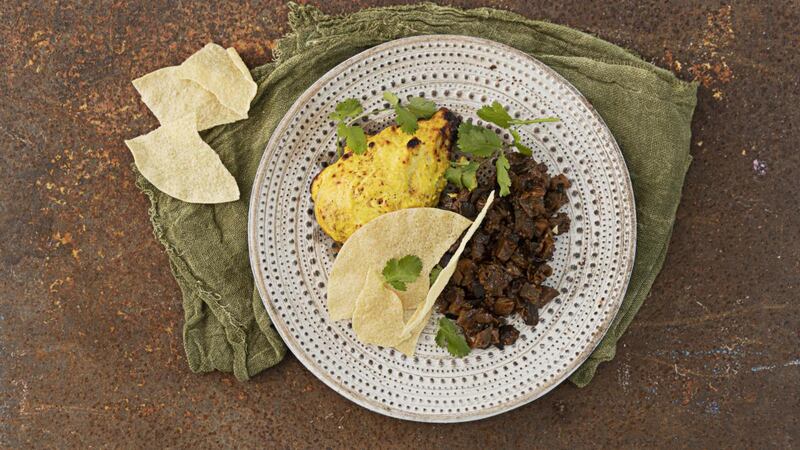 Chicken with yogurt, mild spices and sticky aubergine. Photograph: Harry Weir