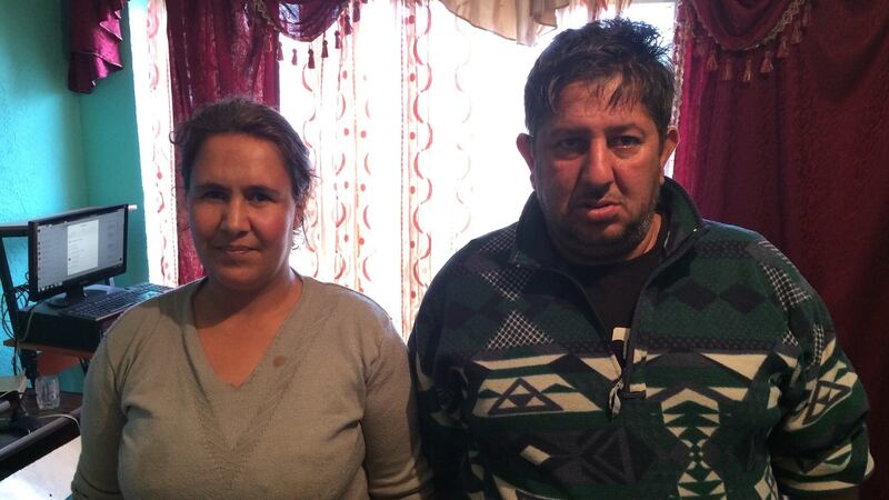 Naser Hajrizi and his wife Jollca in their home in the Roma district of Mitrovica, northern Kosovo. Photograph: Dan McLaughlin