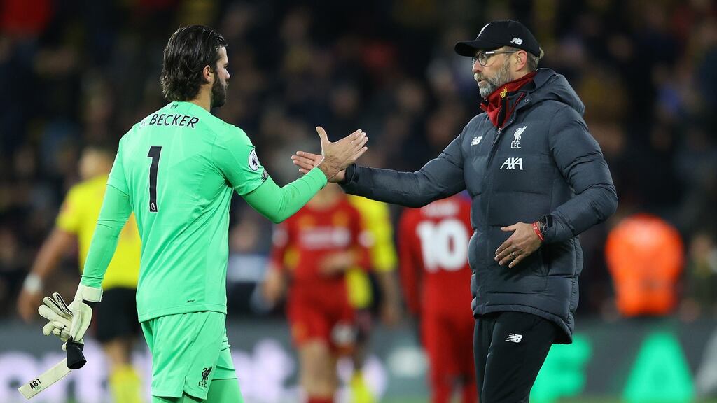 Jurgen Klopp shakes hands with Alisson Becker following their defeat to Watford FC at Vicarage Road. Photograph: Richard Heathcote/Getty Images