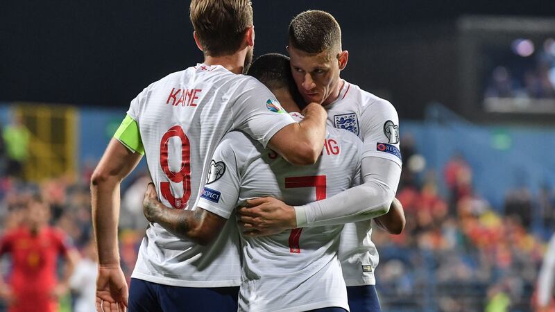 Harry Kane and Ross Barkley celebrate with Raheem Sterling after he scored England’s fifth goal. Photograph: Andrej Isakovic/AFP/Getty
