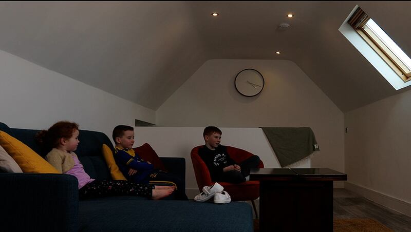 Adam, Jack and Sadie McCann watch the solstice broadcast around the world from Newgrange on a high-speed Viatel connection. Image credit Richard Naylor, RDM Media