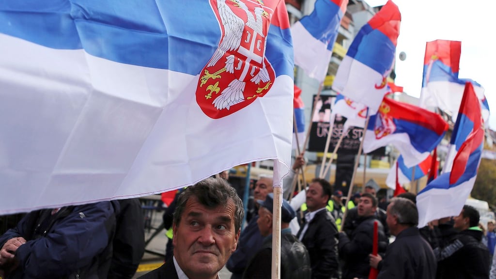 People wave Serbian flags during a rally in the ethnically-divided town of Mitrovica on Friday November 15th 2013. Photograph: Bojan Slavkovic/Reuters