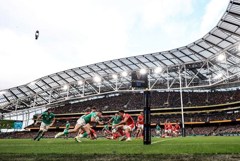 Calvin Nash takes on Wales' Rio Dyer during the Six Nations clash at the Aviva Stadium. Photograph: Dan Sheridan/Inpho