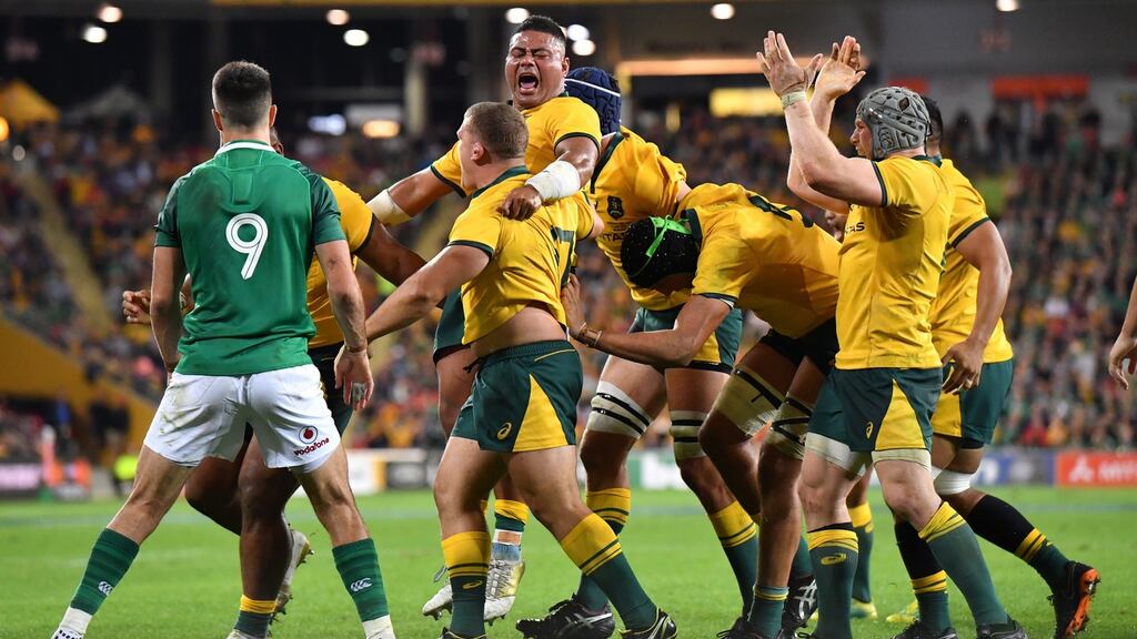 Tolu Latu celebrates after Australia win a crucial scrum penalty at Suncorp Stadium in Brisbane. Photograph: PA
