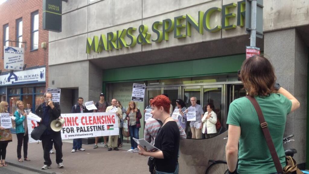 People demonstrated inside and outside the Marks and Spencer store on Mary Street, urging shoppers to boycott Israeli goods. Photograph: Erin McGuire