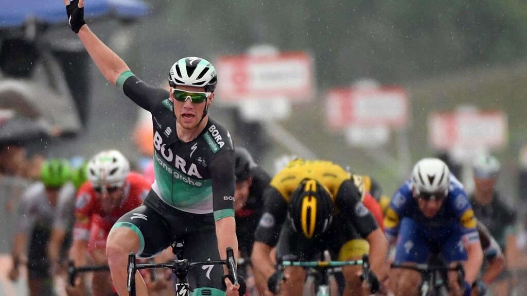 Irish rider Sam Bennett Bora-Hansgrohe celebrates as he crosses the finish line to win the 12th stage of the Giro d’Italia. Photograph: Daniel Dal Zennaro/EPA