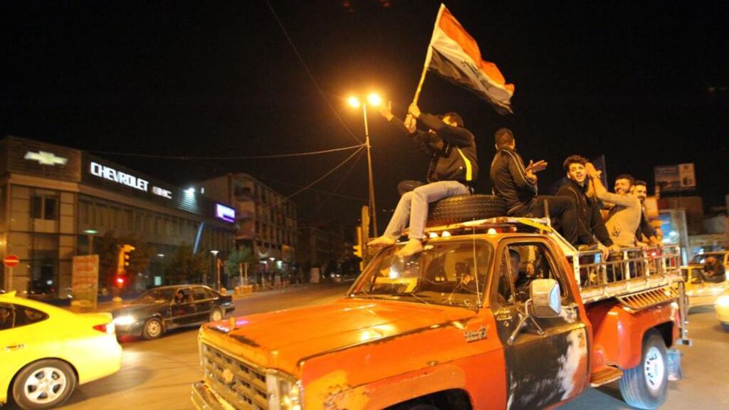 Iraqis celebrate the lift of curfew in central Baghdad at the weekend. A wave of violence has hit the city since Saturday, despite the government lifting the longstanding curfew aimed at normalising life in the city. Photograph: AFP/Getty Images