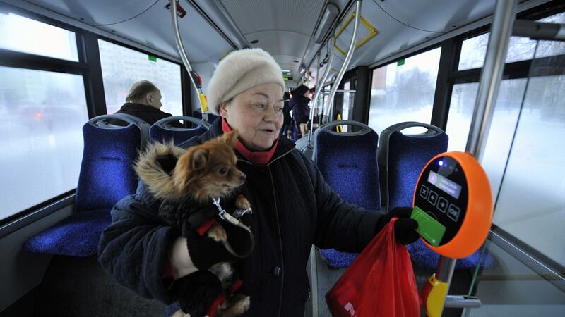 A woman and her dog avail of the free bus service in Tallinn, Estonia. Photograph: Raigo Pajula/AFP/Getty Images